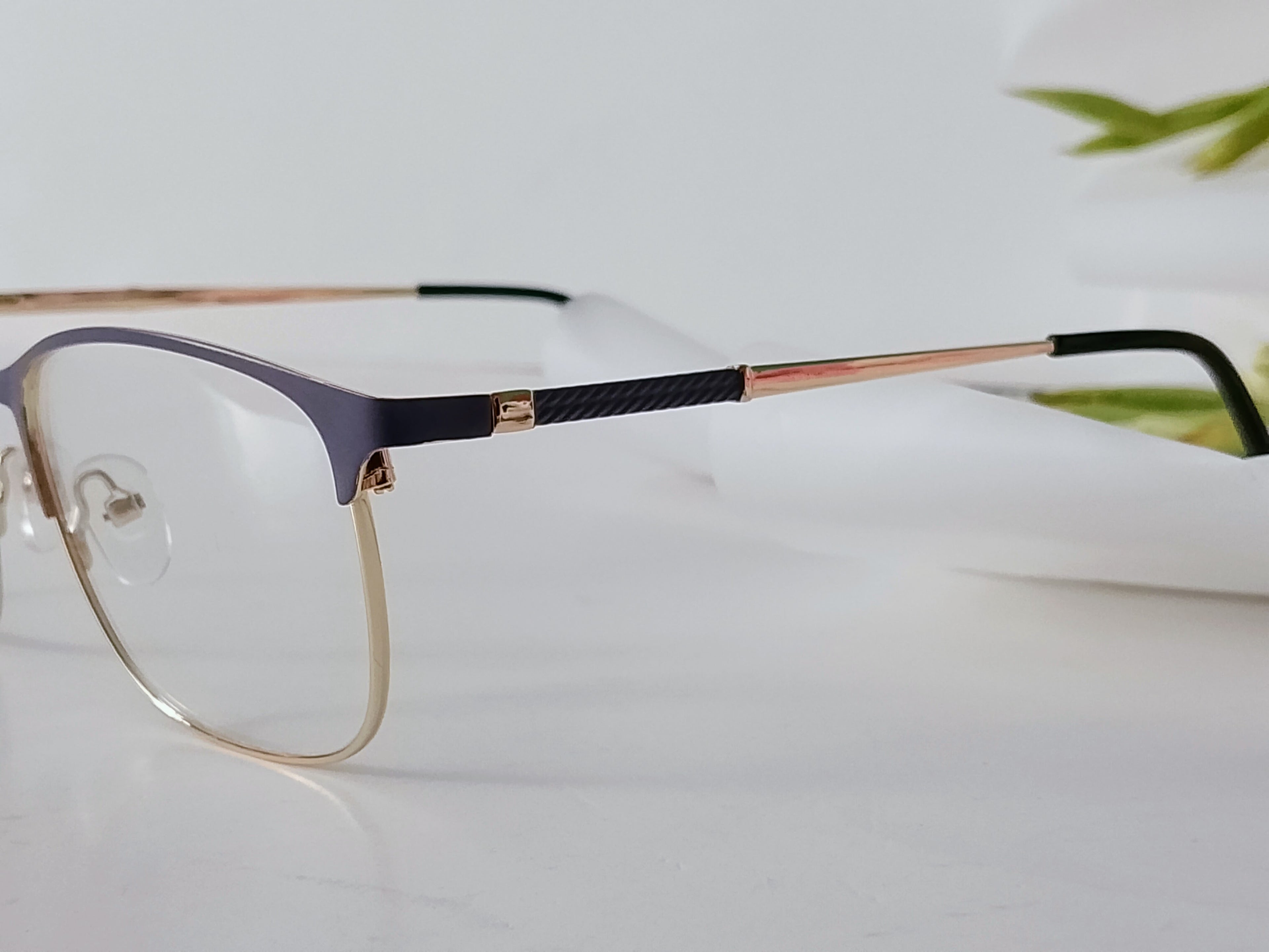 Elegant blue and gold metal stylish frames with carbon fiber temples, modern designer style