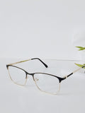 Stylish black and gold half-rim eyeglasses with clear lenses on white surface, modern optical frames