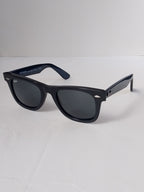 balck wayfarer 3/4 angle on white srface