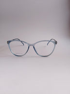 A pair of classic cat-eye eyeglasses with a translucent light blue acetate frame, displayed on a neutral light gray background.