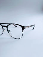 Parsole Frame – matte black half-rim frame, 3/4 angle showing silver hinge detail