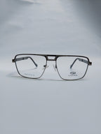 A pair of aviator-style eyeglasses with a thin black metal frame and clear lenses, resting on a light gray surface against a matching gray background. The brand name 'STEPPER' is visible on the lower right lens.