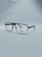 A pair of rectangular eyeglasses with a dark brown metal frame and clear lenses, resting on a light gray background. The brand name 'STEFFER' is printed on the lower part of the right lens.