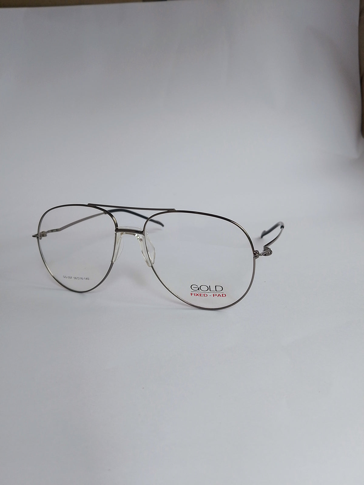 A pair of vintage aviator-style eyeglasses with thin silver-tone metal frames and clear lenses, featuring the brand name 'GOLD' printed in red on the lower right frame, set against a plain light gray background.