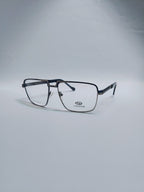A pair of square metal eyeglasses with a dark gray and black frame, clear lenses, set against a light gray studio background.