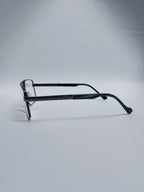 A pair of  eyeglasses with a black metal frame and dark  blur acetate temples, on gray studio light