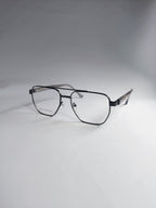 A pair of black metal eyeglasses with a double-bridge design and clear lenses, displayed on a light gray background.
