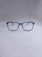 A pair of square-frame eyeglasses with a translucent dark blue acetate frame and clear lenses, displayed on a neutral light gray background.