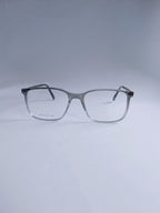 A pair of square eyeglasses with a gray to white gradient acetate frame and clear lenses, displayed on a light gray studio background.