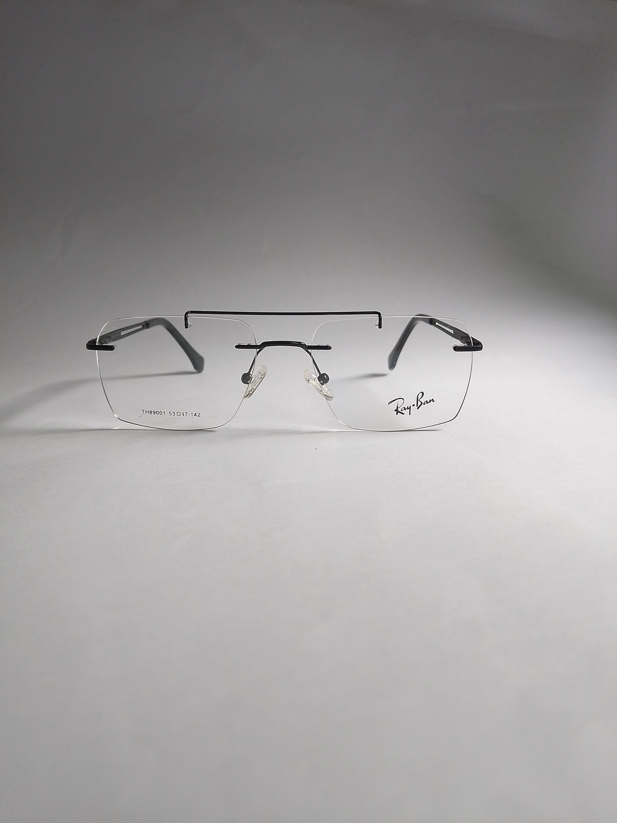 Rexon black rimless rectangular eyeglasses front view