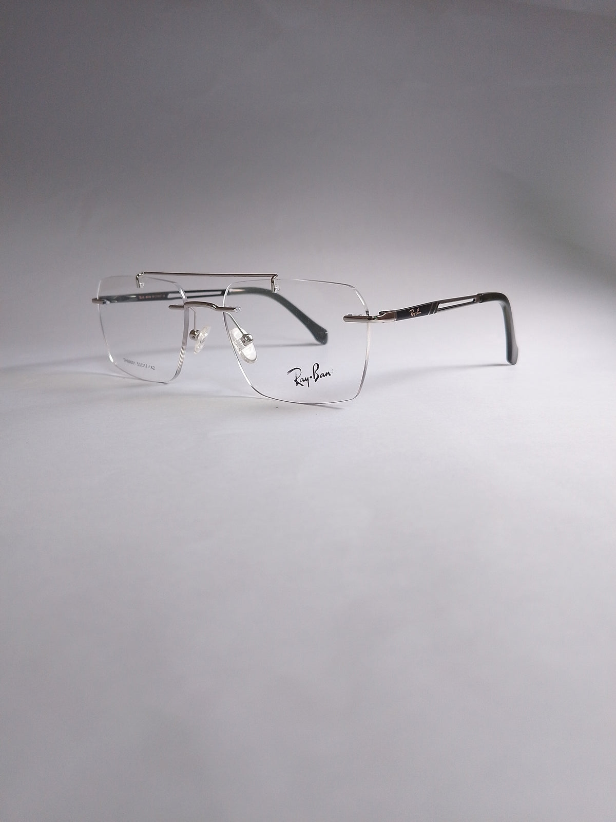 Rexon silver double-bridge stylish frame three-quarter view