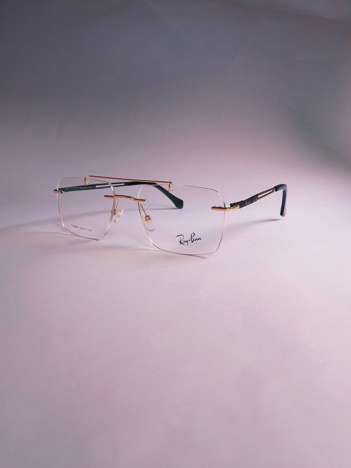 Rexon golden double-bridge stylish frame three-quarter view