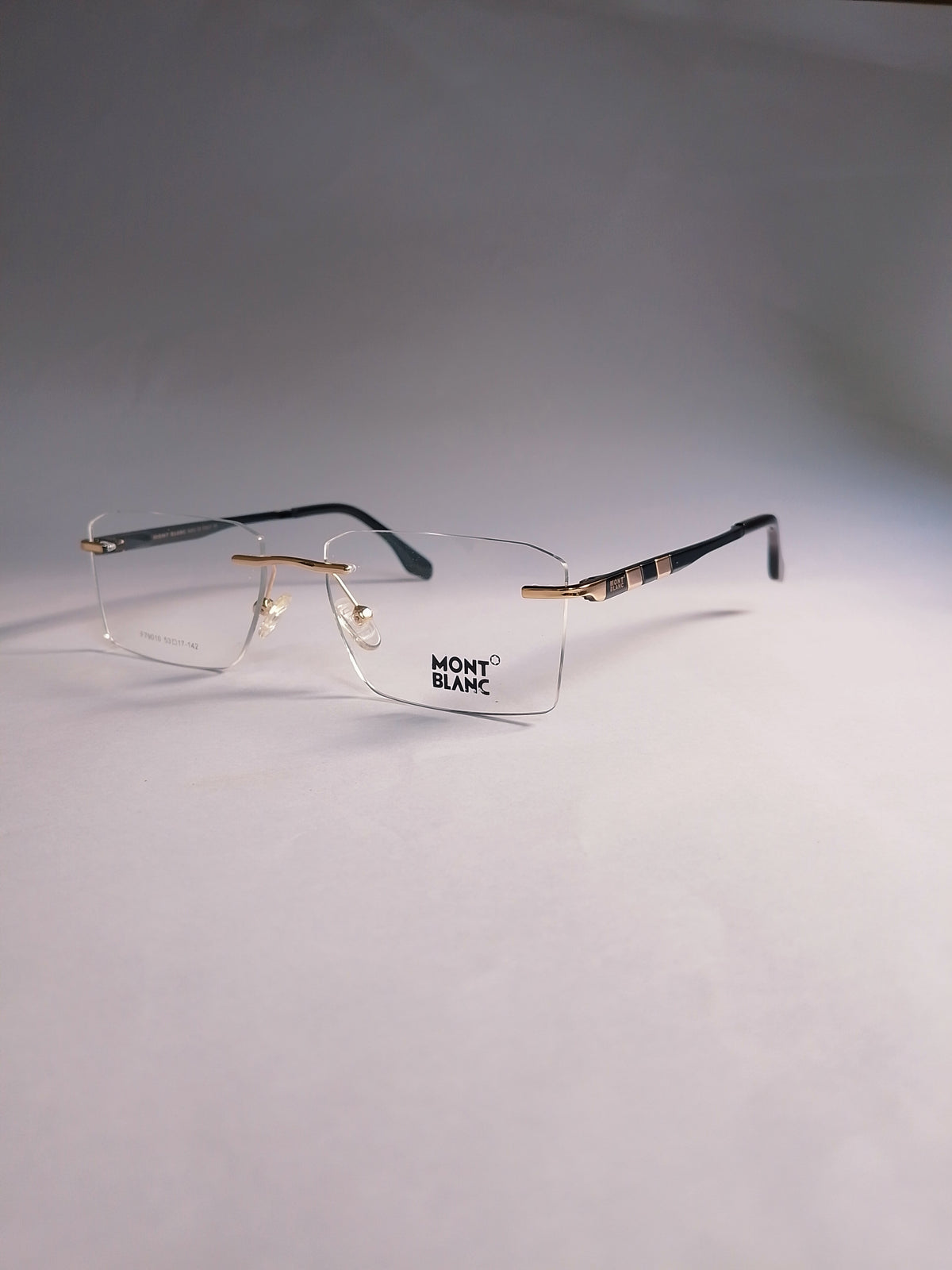 Orin rimless stylish frame three-quarter view with gold and black temples