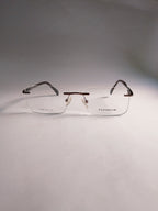  rimless eyeglasses with clear lenses and dark brown temples, displayed on a neutral gray background.