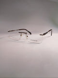  rimless eyeglasses with a clear full-rim front and dark brown tortoiseshell temples, displayed on a light gray background.
