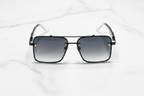 Stylish black aviator sunglasses with gradient lenses on marble surface