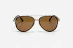 Ray-Ban aviator sunglasses with brown lenses and gold frame on white background
