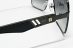 Persol black aviator sunglasses with gold logo detail and sleek temple design