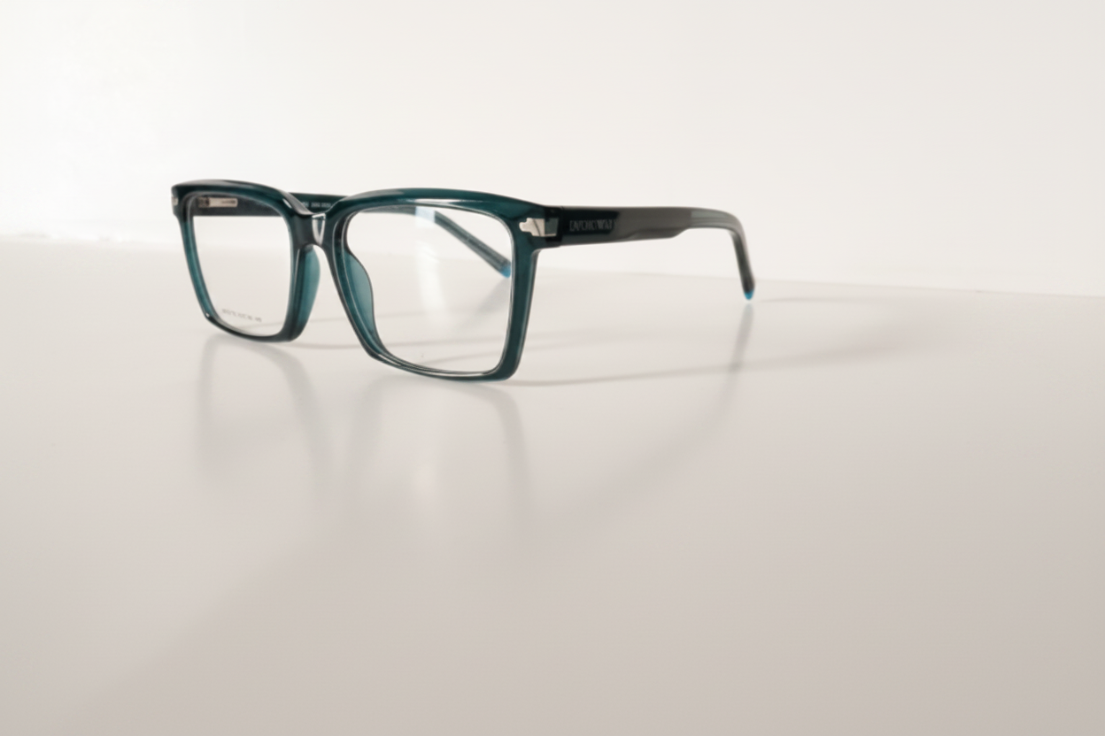 Teal rectangular eyeglasses with clear lenses on white surface, modern optical frames for men or women