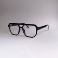 Black oversized square eyeglasses with a double bridge and clear lenses, displayed on a neutral light gray background.by aroptic